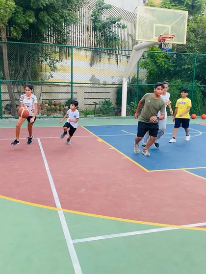 A young player learns to dribble with his head up.