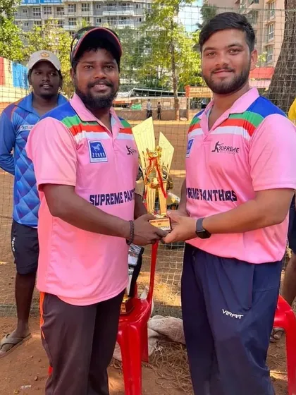 Jeet Pandit receiving the 'Best Batsman' trophy. His powerful hitting was a highlight of the local Supreme league.