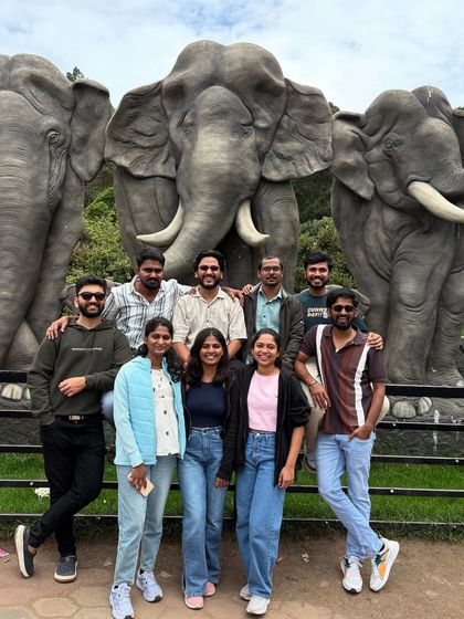 Our group posing with elephant statues, a popular spot in Kodaikanal.