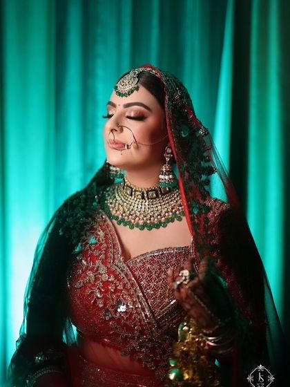 A serene moment captured. Even with eyes closed, the makeup speaks volumes. The blended eyeshadow and radiant skin create a look of pure bridal elegance.