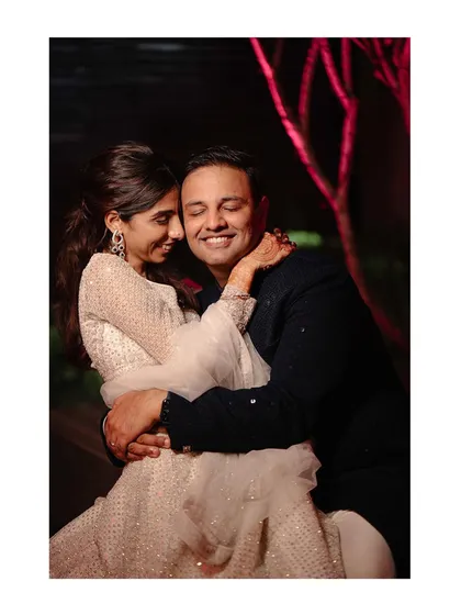 A warm, candid embrace between the couple during their Sangeet. These are the moments of connection we look for amidst the party.
