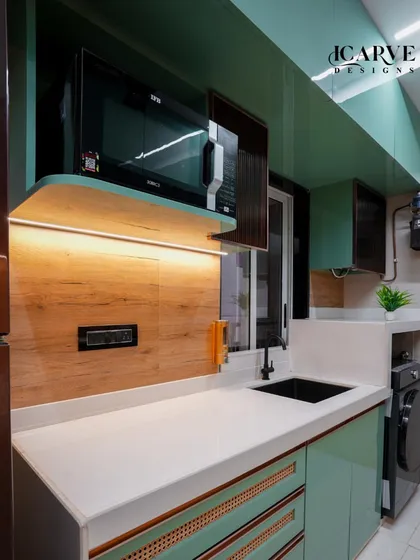 We even made space for a washing machine in this compact kitchen layout, demonstrating our commitment to functional design.