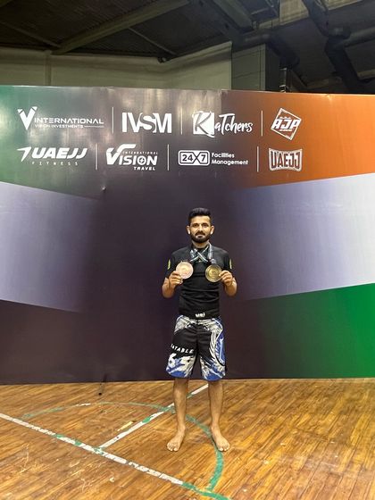 Another one of our fighters displaying his medals. We are proud of the team's performance and their dedication to the sport.