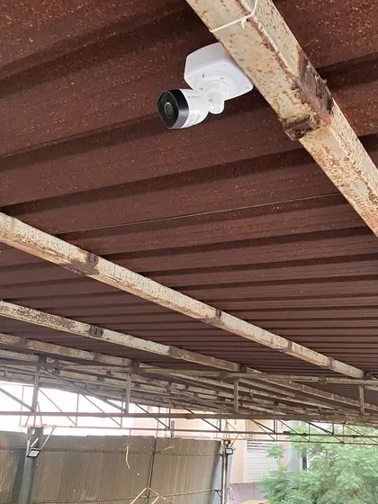 A CP Plus bullet camera installed under a rusty tin roof at a site near the airport. Our all-weather cameras are built to withstand harsh industrial environments.