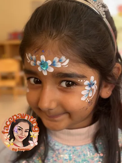 A simple and elegant princess crown in shades of blue and white. The glitter adds a touch of icy magic, perfect for a Frozen theme.