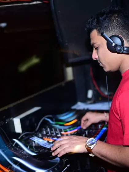 The light trails in this photo capture the motion and energy of a live DJ set. I'm in my element, mixing a high-tempo commercial and hip hop set.