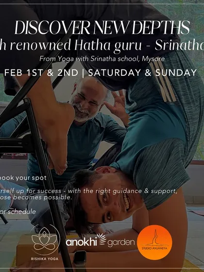 Experience the depth of traditional yoga with hands-on guidance from a master. Here, renowned Hatha guru Srinatha Sir from Mysore helps a student refine their alignment in an inversion, ensuring a safe and profound practice.