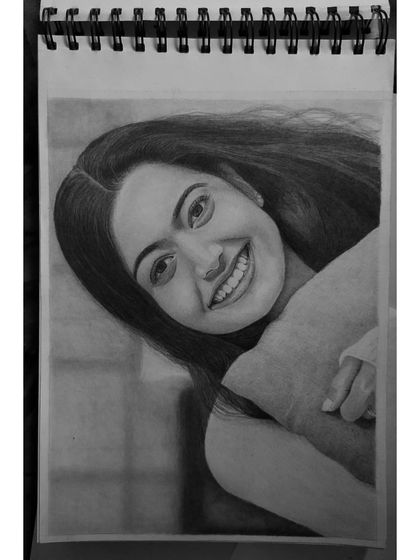 A slightly different composition of the Rashmika Mandanna portrait, showing how the drawing fills the page in my sketchbook.