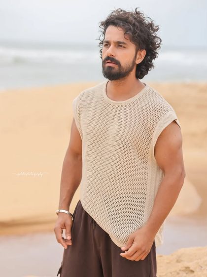 A series of portraits of actor Pruthvi Ambaar on location. These shots showcase a rugged, casual look against natural and industrial backdrops, highlighting his versatility.