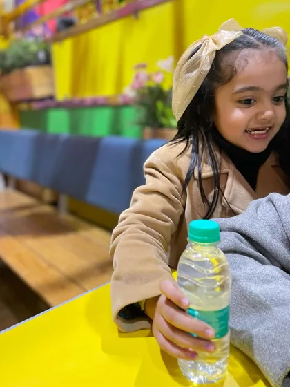 A happy smile after a refreshing drink. We make sure to have plenty of options to keep the kids hydrated and happy.