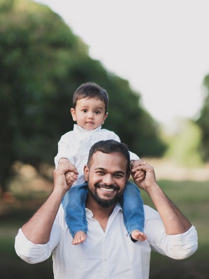A classic father and son portrait, enjoying a moment outdoors.