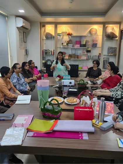 I believe in a comprehensive education. Here, I am addressing the students during our visit to the Smithers-Oasis factory, explaining the importance of quality materials in floral design.