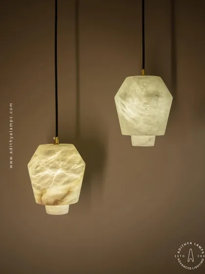 The unique veining of the marble is clearly visible in this shot, highlighting the natural, one-of-a-kind beauty of each pendant light.