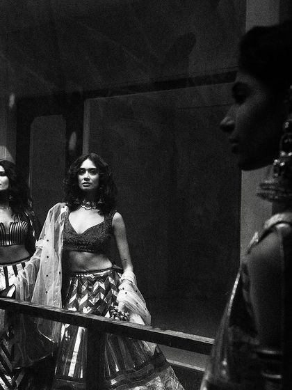 A moody, atmospheric black and white shot for designer Siddartha Tytler. The reflections and shadows create a complex, layered image that is both artistic and high-fashion.