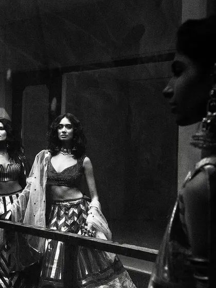 A moody, atmospheric black and white shot for designer Siddartha Tytler. The reflections and shadows create a complex, layered image that is both artistic and high-fashion.