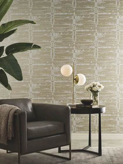 This wallcovering offers a unique blend of texture and pattern with its distressed, block-like design in neutral tones. It creates a sophisticated and modern backdrop for a contemporary living space.