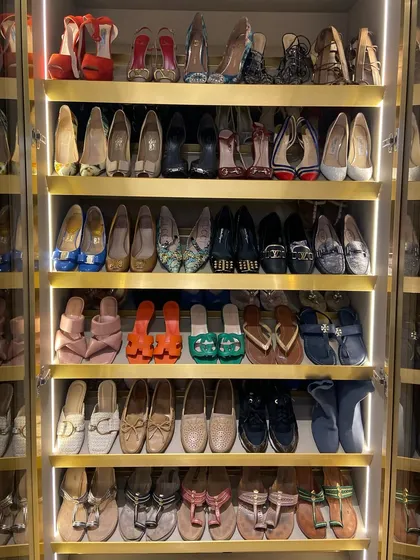 For the true shoe lover, we design and organize collections to feel like a luxury footwear gallery. This custom shoe closet uses angled, lit shelves to display each pair, making them easy to see and access while keeping them in pristine condition.