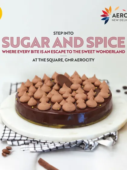 A beautifully decorated chocolate cake from Sugar & Spice. This image invites you to step into a sweet wonderland where every bite is an escape.