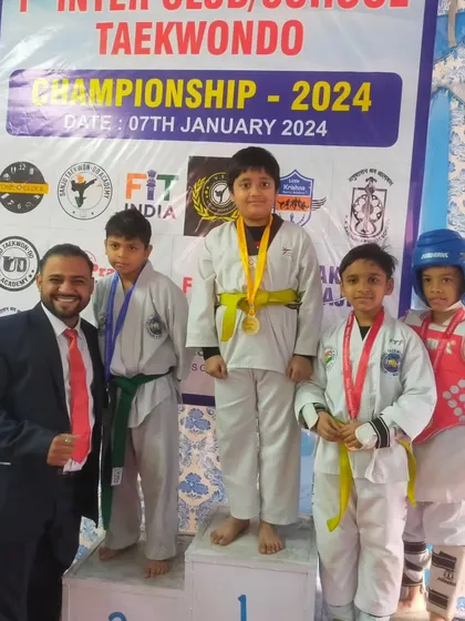 Celebrating a gold medal win with one of our youngest competitors at the Inter-Club event.