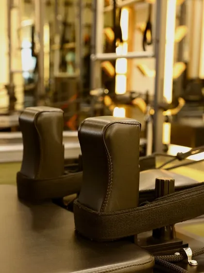 A close-up of the reformer shoulder rests. Every piece of our Balanced Body equipment is designed for comfort and effectiveness.
