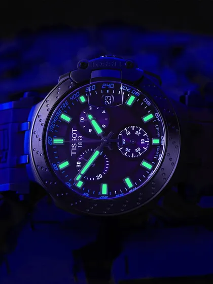 Let it glow. This Tissot watch has incredible lume, and I wanted to capture that electric green-blue glow in the dark. This shot uses UV light to charge the markers and hands, creating a dramatic, moody image that highlights a key feature of the watch.