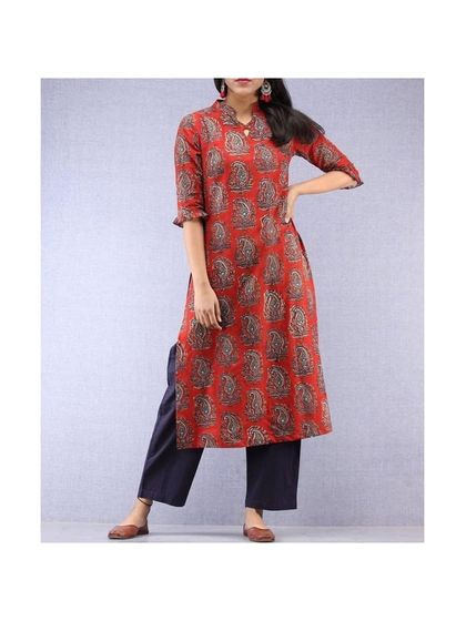 This straight-cut kurti in a red block-print fabric features a mandarin collar and three-quarter sleeves. It's a classic design that I can stitch to your exact measurements for a perfect everyday ethnic look.