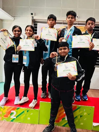 The joy of achievement is a powerful motivator. This is a moment from the Karnataka 3rd Mini Olympic Games, where our young shooters stood proudly on the podium with their medals and certificates. Every camp ends with a competition to give all kids this experience.