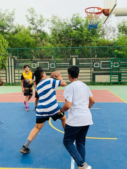 A player takes a shot over a defender.