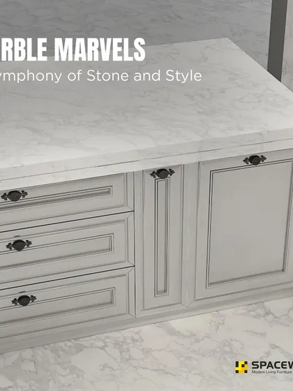 This kitchen island is a true marble marvel, combining a beautiful stone countertop with classic panelled cabinetry. The dark, vintage-style handles provide a striking contrast against the light grey drawers and doors.