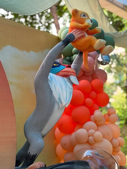 A detailed shot of the Rafiki and Simba prop, showing the craftsmanship involved in creating these memorable, three dimensional party elements.