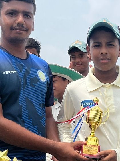 Chirag Upadhyay receiving his Best Batsman trophy from one of our senior players.