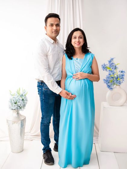 A classic standing portrait of the couple in our bright and airy minimalist set. The clean white background and simple styling create a timeless and elegant look.