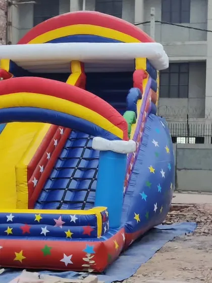 A starry night-themed slide with rainbow arches. The star pattern on the sides gives it a distinct look.