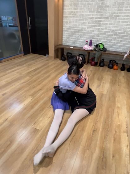 A hug between two students after a tough class. The support they give each other is the foundation of our ballet family.