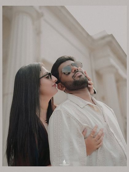 A stylish and intimate close-up. The low angle and focus on their interaction give it a very cinematic quality.