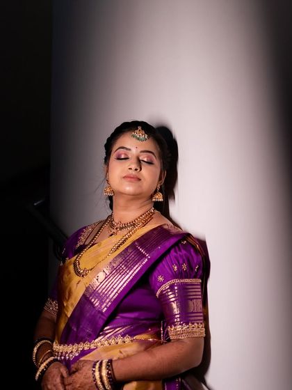 A duplicate of 220, a creative shot of Varshini with her eyes closed.