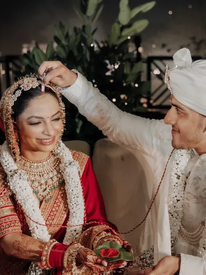 The sacred moment of applying sindoor, a promise of lifelong companionship. We create an intimate setting for these deeply personal and traditional rituals.