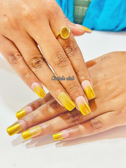 Bright and sunny yellow chrome ombre nails. This set also features a sparkling sugar glitter accent nail.