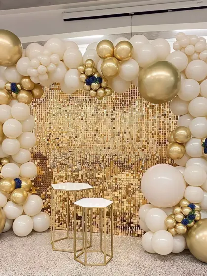 Another elegant take on the gold sequin wall. This version uses white and gold balloons with small navy blue accents for a touch of classic color.