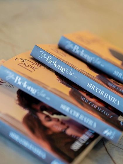 A beautifully arranged stack of books ready for signing, highlighting the professional presentation at our events.