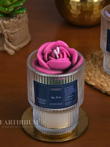 The 'After Dark' candle in a stunning magenta, designed for slow evenings and creating a cozy, intimate mood.