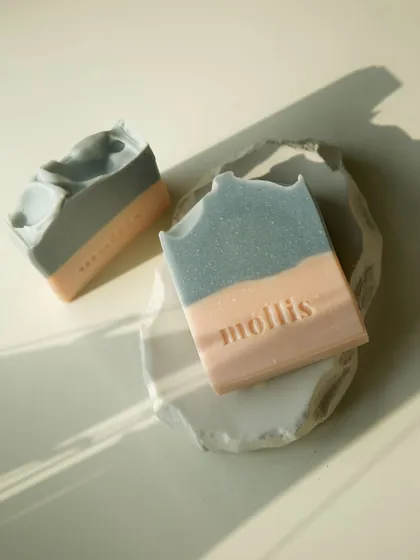 The 'Sweet Sage' bar on a handmade dish, a perfect pair for a sustainable bathroom.