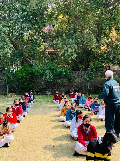 A moment of instruction during our self-defense camp at Day Time Secondary School in Kidwai Nagar. Here, I am explaining the principles behind a technique to a seated group of students.