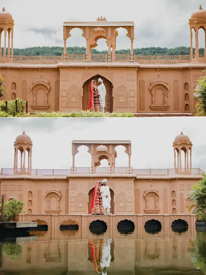 A stunning reflection shot of the couple standing on a bridge over the water. The symmetry and the grand architecture create a breathtaking and artistic wedding portrait.