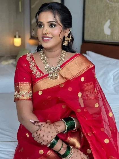 A candid moment of the bride, her makeup looking flawless and natural. I focus on creating looks that feel comfortable and look beautiful.