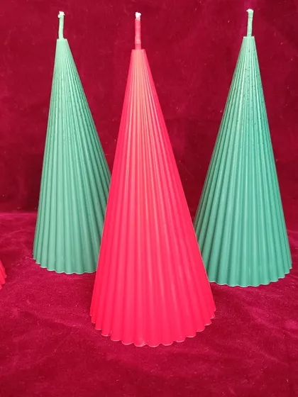 A close-up of the red and green ribbed pillar candles for Christmas.