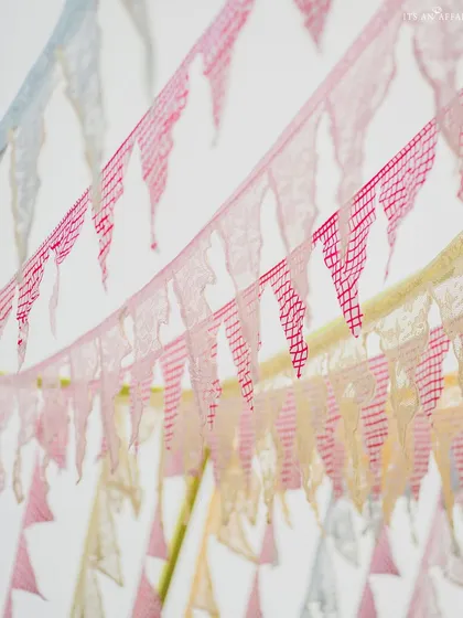 Colorful bunting flags add a playful and festive touch to the 'Picnic in the Mountains' theme.