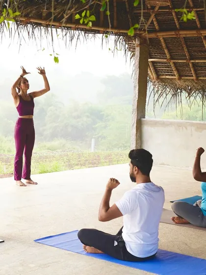 Leading a group in a seated practice during a wellness retreat. These moments of shared stillness and intention are incredibly powerful for building community and connection.