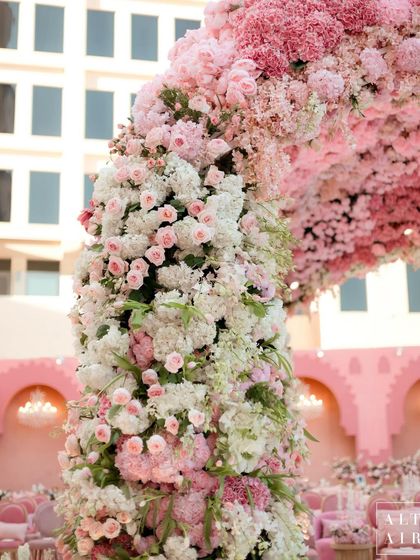 A detailed shot of the floral column on the 'Echoes of Pink' mandap, showcasing the density and variety of flowers used to create this lush, romantic structure.