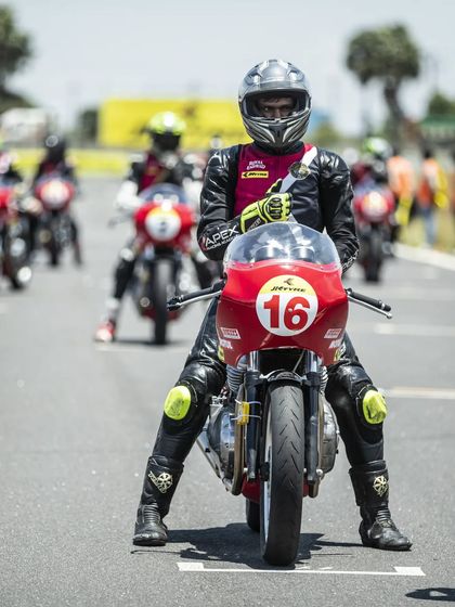 Sriram S sits focused on the grid aboard his Royal Enfield Continental GT, ready for the race to start. His strong qualifying and race performance placed him among the top amateurs.